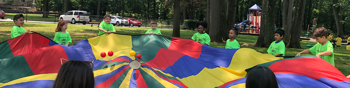 Memorial students having fun with a parachute on field day